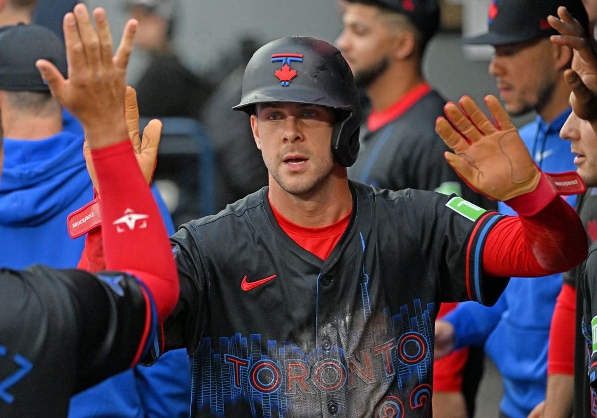 May 30, 2025; Toronto, Ontario, CAN;  Toronto Blue Jays second baseman Ernie Clement (22) celebrates with teammates in the dugout after scoring a run against the Athletics in the second inning at Rogers Centre. Mandatory Credit: Dan Hamilton-Imagn Images