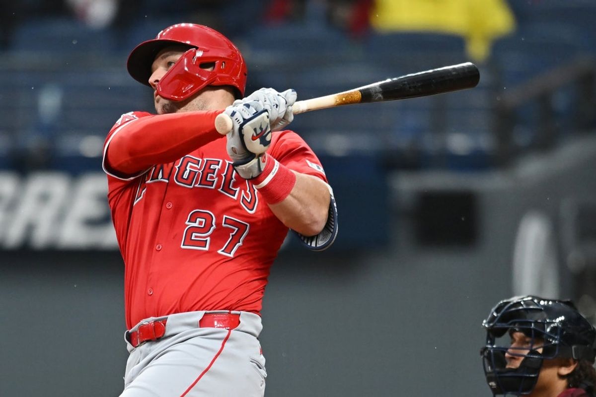 May 30, 2025; Cleveland, Ohio, USA; Los Angeles Angels designated hitter Mike Trout (27) hits a single during the fourth inning against the Cleveland Guardians at Progressive Field. Mandatory Credit: Ken Blaze-Imagn Images