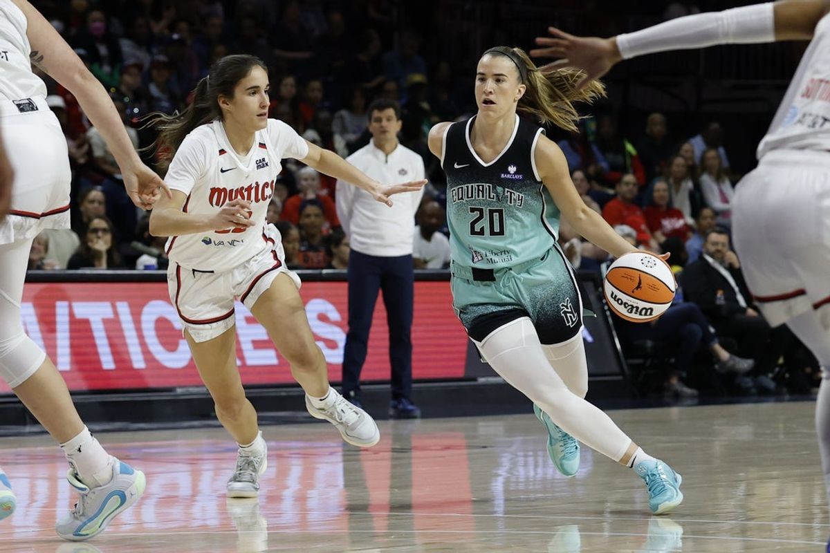 May 30, 2025; Washington, District of Columbia, USA; New York Liberty guard Sabrina Ionescu (20) drives to the basket as Washington Mystics guard Sonia Citron (22) defends in the first half at CareFirst Arena. Mandatory Credit: Geoff Burke-Imagn Images
