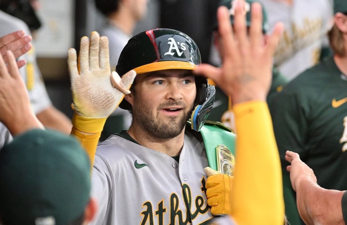 May 30, 2025; Toronto, Ontario, CAN;  Athetics catcher Shea Langeliers (26) is greeted by teammates in the dugout after hitting a solo home run against the Toronto Blue Jays in the fourth inning at Rogers Centre. Mandatory Credit: Dan Hamilton-Imagn Images