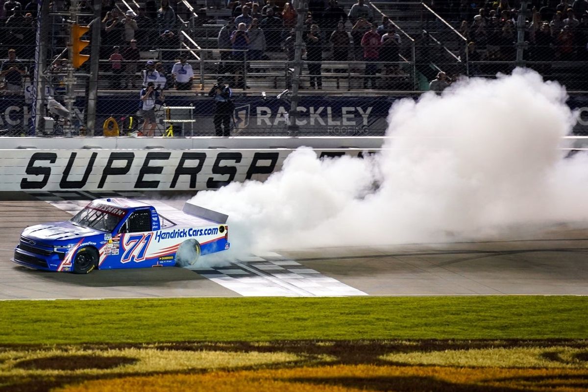 NASCAR Truck Series driver Rajah Caruth celebrates winning the Rackley Roofing 200 with a burnout at Nashville Superspeedway in Nashville, Tenn., Friday, May 30, 2025.