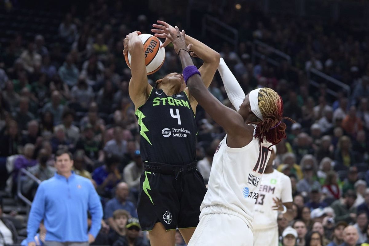May 30, 2025; Seattle, Washington, USA; Seattle Storm guard Skylar Diggins (4) is fouled by Atlanta Dream guard Rhyne Howard (10) during the first half at Climate Pledge Arena. Mandatory Credit: John Froschauer-Imagn Images