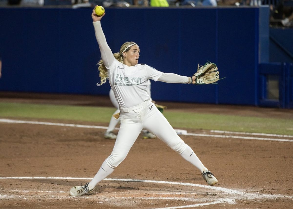 May 30, 2025; Oklahoma City, OK, USA;  Oregon Ducks pitcher Lyndsey Grein (33) throws a pitch in the second inning against the Ole Miss Rebels during the NCAA Softball Women's College World Series at Devon Park. Mandatory Credit: Brett Rojo-Imagn Images