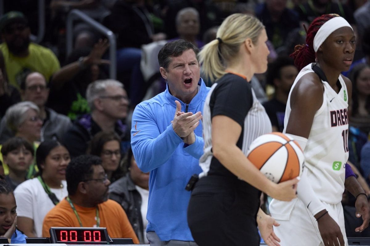 May 30, 2025; Seattle, Washington, USA; Atlanta Dream head coach Dan Padover, back left, reacts to a call during the first half against the Seattle Storm at Climate Pledge Arena. Mandatory Credit: John Froschauer-Imagn Images