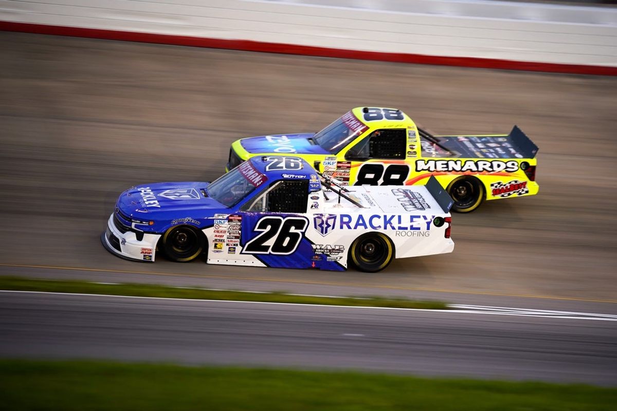 NASCAR Truck Series driver Dawson Sutton (26) and Matt Crafton (88) race during the Rackley Roofing 200 at Nashville Superspeedway in Lebanon, Tenn., Friday, May 30, 2025.