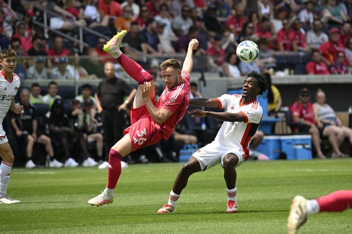 May 31, 2025; St. Louis, Missouri, USA; St. Louis City forward Cedric Teuchert (36) kicks the ball as San Jose Earthquakes defender Jamar Ricketts (2) defends at Energizer Park. Mandatory Credit: Scott Rovak-Imagn Images