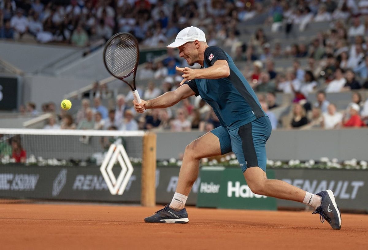 May 31, 2025; Paris, FR; Filip Misolic of Austria returns a shot during his match against Novak Djokovic of Serbia on day seven at Roland Garros Stadium.  Mandatory Credit: Susan Mullane-Imagn Images