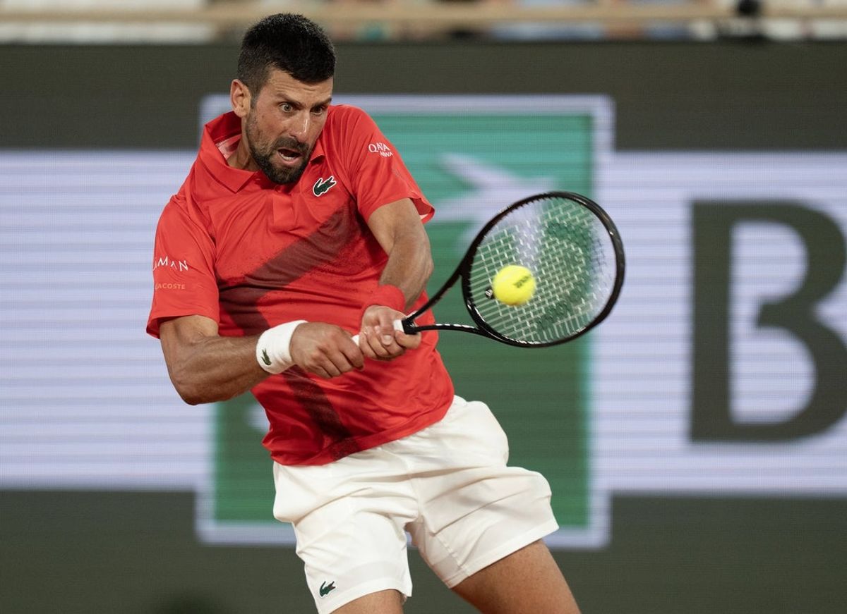 May 31, 2025; Paris, FR; Novak Djokovic of Serbia returns a shot during his match against Filip Misolic of Austria on day seven at Roland Garros Stadium.  Mandatory Credit: Susan Mullane-Imagn Images