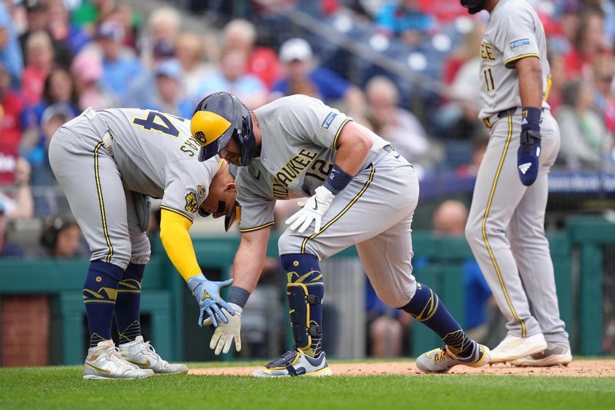 May 31, 2025; Philadelphia, Pennsylvania, USA; Milwaukee Brewers infielder Rhys Hoskins (12) reacts with catcher William Contreras (24) after hitting a three-run home run against the Philadelphia Phillies in the fourth inning at Citizens Bank Park. Mandatory Credit: Kyle Ross-Imagn Images