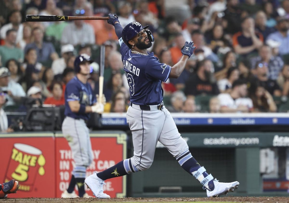 May 31, 2025; Houston, Texas, USA; Tampa Bay Rays designated hitter Junior Caminero (13) hits a double during the sixth inning against the Houston Astros at Daikin Park. Mandatory Credit: Troy Taormina-Imagn Images