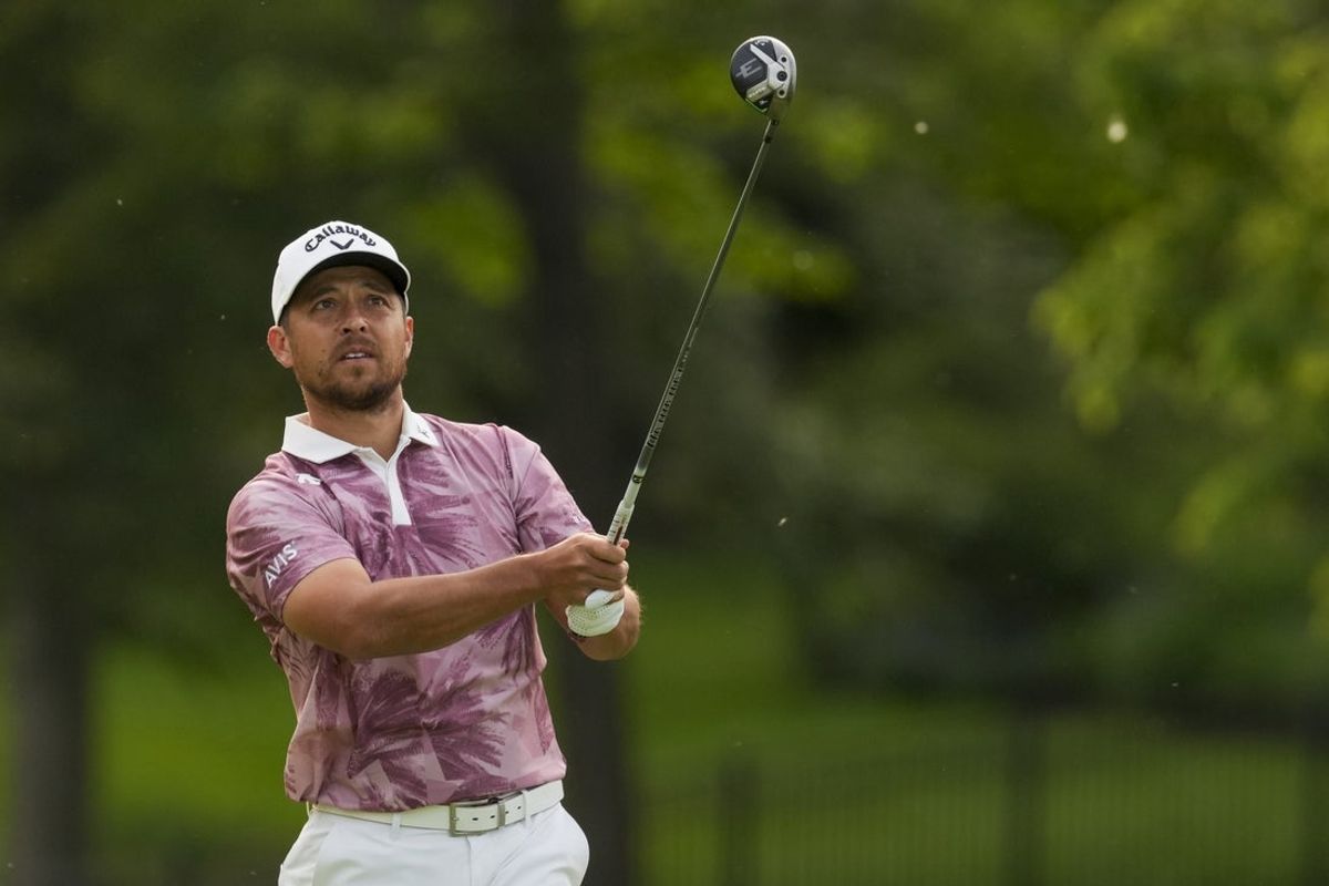 May 31, 2025; Dublin, Ohio, USA; Xander Schauffele plays his shot from the 18th tee during the third round of the Memorial Tournament presented by Workday golf tournament. Mandatory Credit: Aaron Doster-Imagn Images