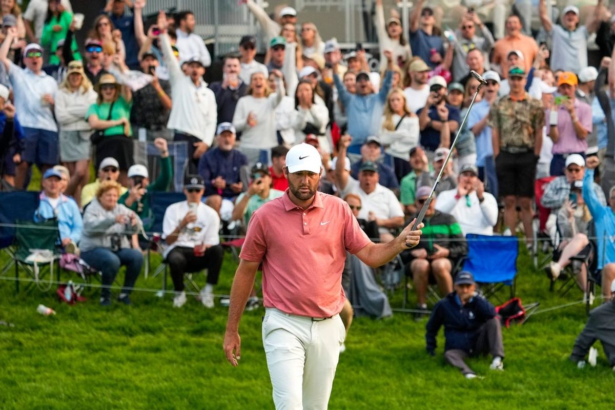 Scottie Scheffler reacts after sinking his putt on the 18th hole during the third round of the Memorial Tournament at Muirfield Village Golf Course on Saturday, May 31, 2025 in Dublin, Ohio.