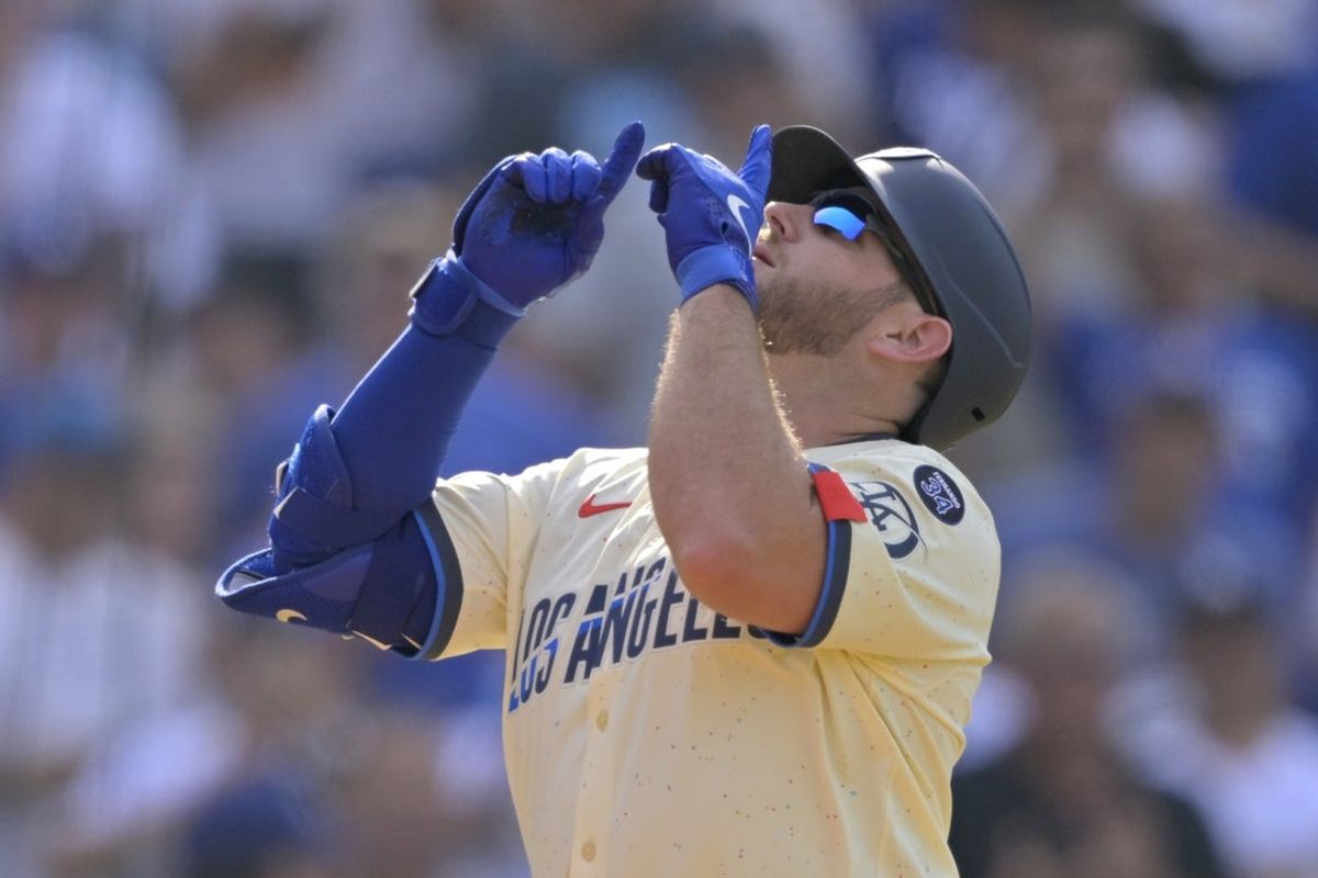 May 31, 2025; Los Angeles, California, USA; Los Angeles Dodgers third baseman Max Muncy (13) celebrates after hitting a three run home run against the New York Yankees in the second inning at Dodger Stadium. Mandatory Credit: Jayne Kamin-Oncea-Imagn Images