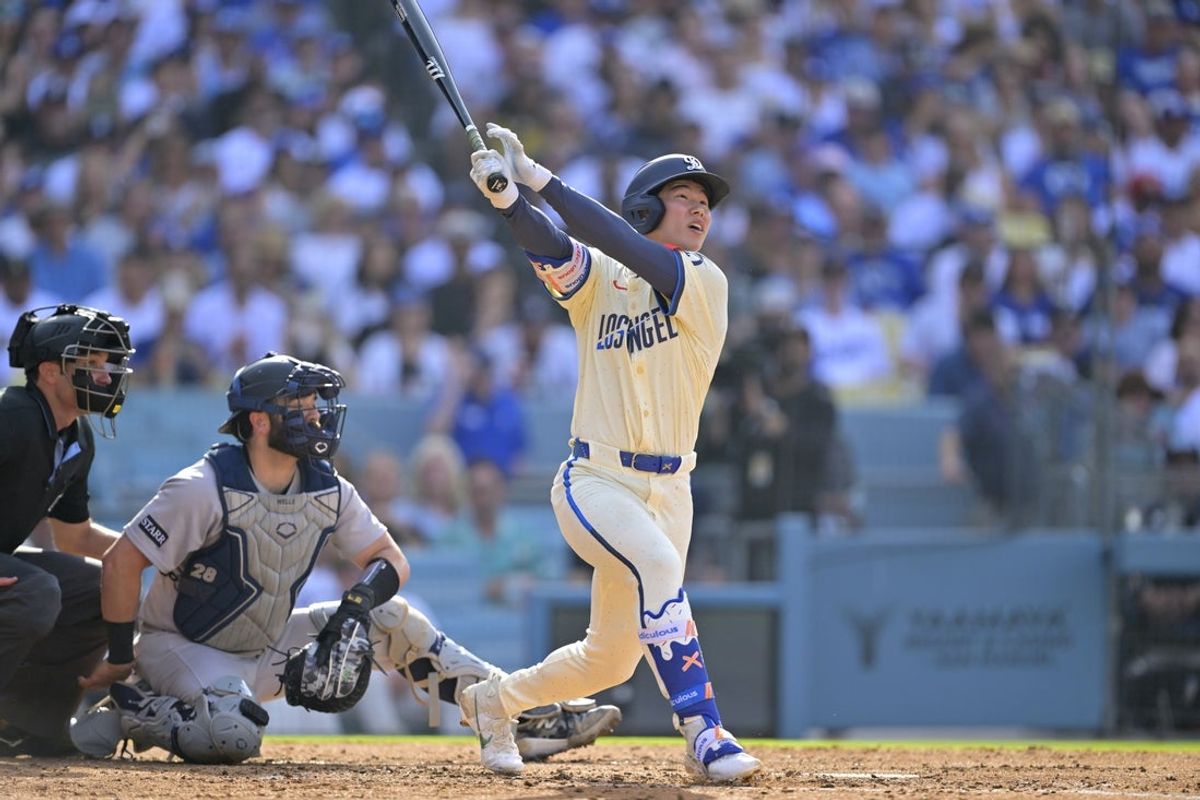 May 31, 2025; Los Angeles, California, USA; Los Angeles Dodgers second baseman Hyeseong Kim (6) hits a home run in the second inning against the New York Yankees at Dodger Stadium. Mandatory Credit: Jayne Kamin-Oncea-Imagn Images