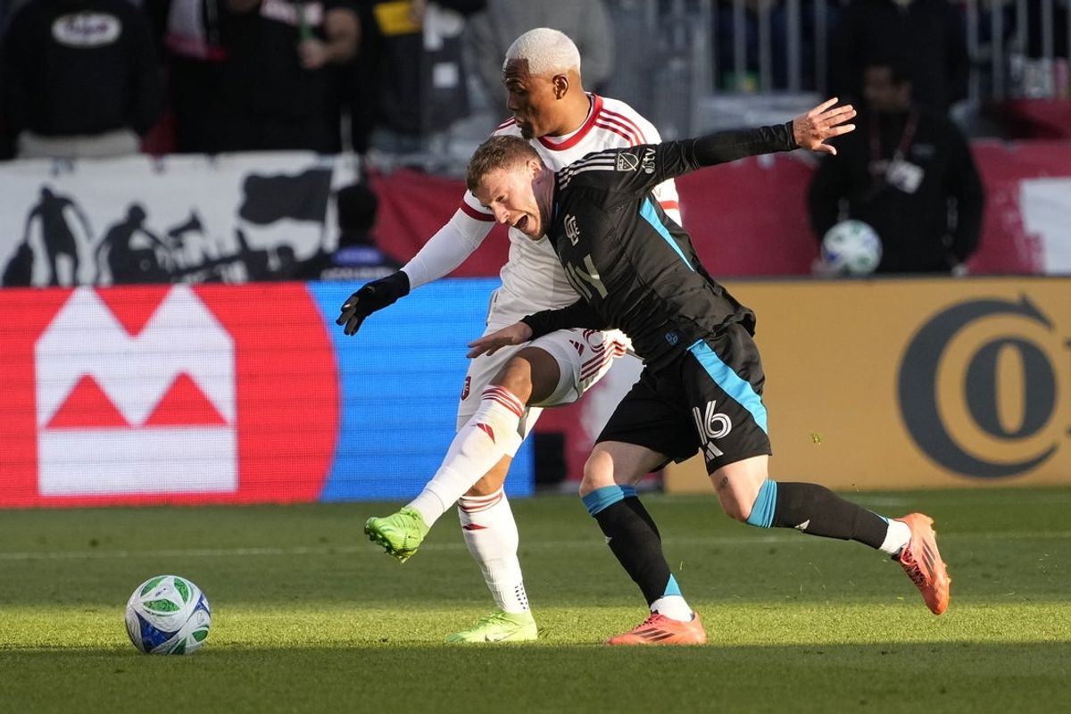 May 31, 2025; Toronto, Ontario, CAN; Charlotte FC midfielder Pep Biel (16) and Toronto FC midfielder Deybi Flores (20) battle for the ball during the first half at BMO Field. Mandatory Credit: John E. Sokolowski-Imagn Images