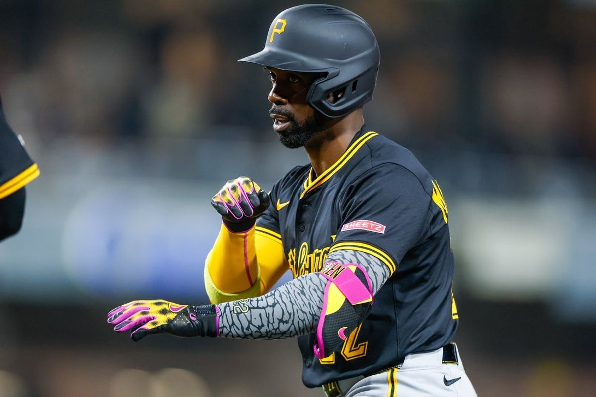 May 31, 2025; San Diego, California, USA; Pittsburgh Pirates designated hitter Andrew McCutchen (22) celebrates with the dugout after hitting a single during the seventh inning against the San Diego Padres at Petco Park. Mandatory Credit: David Frerker-Imagn Images