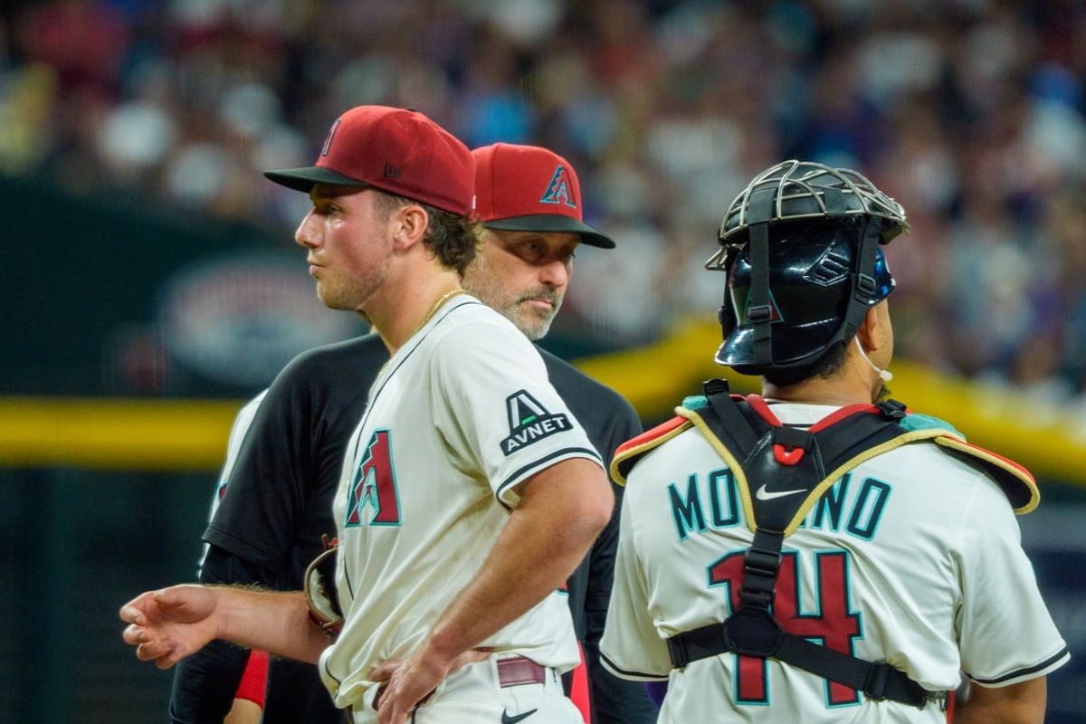 May 31, 2025; Phoenix, Arizona, USA;  Arizona Diamondbacks pitcher Brandon Pfaadt (32) and manager Corey Lovell (17) react after Pfaadt is replaced after giving up nine runs in the first inning against the Washington Nationals at Chase Field. Mandatory Credit: Allan Henry-Imagn Images