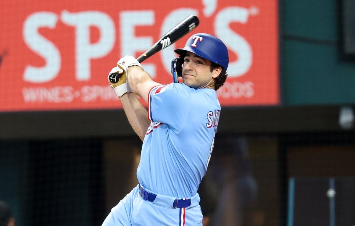 Jun 1, 2025; Arlington, Texas, USA; Texas Rangers first baseman Josh Smith (8) hits a two run double during the second inning against the St. Louis Cardinals at Globe Life Field. Mandatory Credit: Kevin Jairaj-Imagn Images