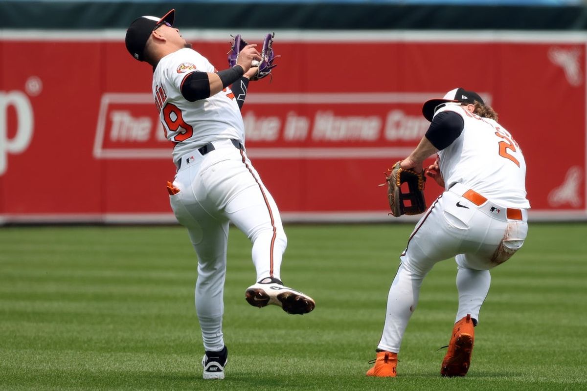 Jun 1, 2025; Baltimore, Maryland, USA; Baltimore Orioles third baseman Ramon Urias (29) makes a catch for an out during the first inning against the Chicago White Sox at Oriole Park at Camden Yards. Mandatory Credit: Daniel Kucin Jr.-Imagn Images