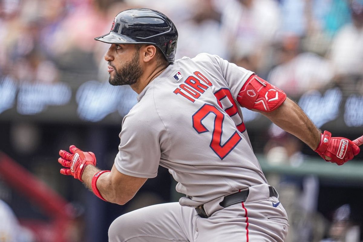 Jun 1, 2025; Cumberland, Georgia, USA; Boston Red Sox first baseman Abraham Toro (29) hits a single against the Atlanta Braves during the first inning at Truist Park. Mandatory Credit: Dale Zanine-Imagn Images
