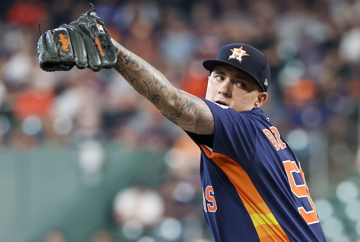 Jun 1, 2025; Houston, Texas, USA; Houston Astros starting pitcher Hunter Brown (58) pitches against the Tampa Bay Rays in the first inning at Daikin Park. Mandatory Credit: Thomas Shea-Imagn Images