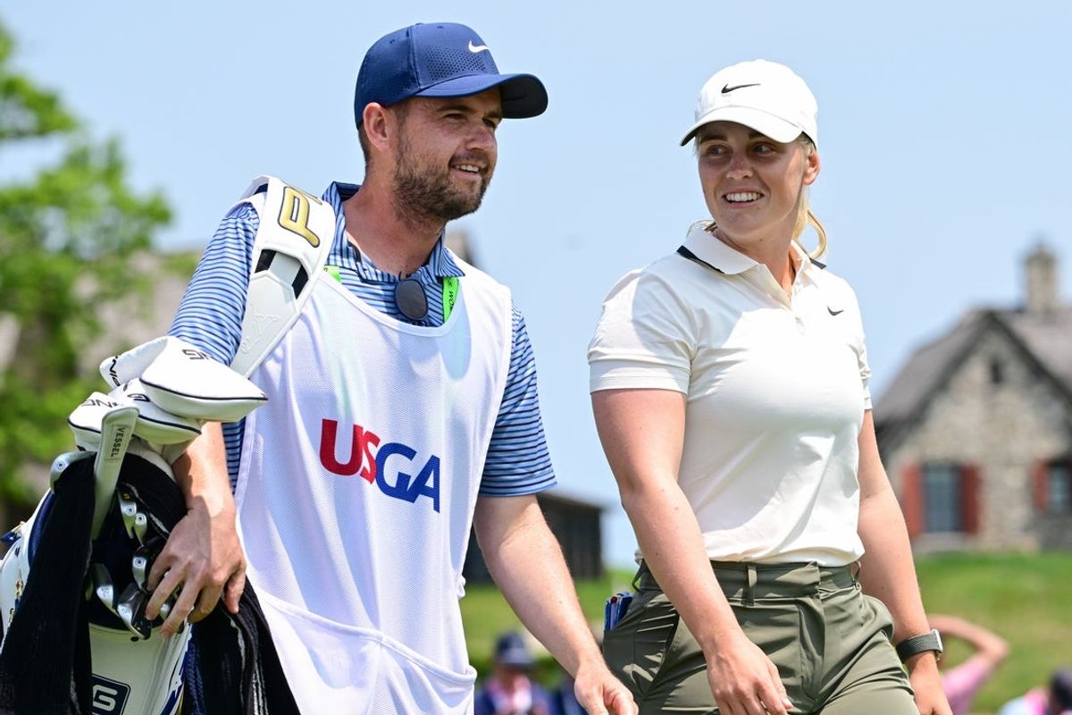 Jun 1, 2025; Erin, Wisconsin, USA; Maja Stark smiles with her caddy, jeff Brighton, after teeing off the 1st hole during the final round of the U.S. Women's Open golf tournament. Mandatory Credit: Benny Sieu-Imagn Images