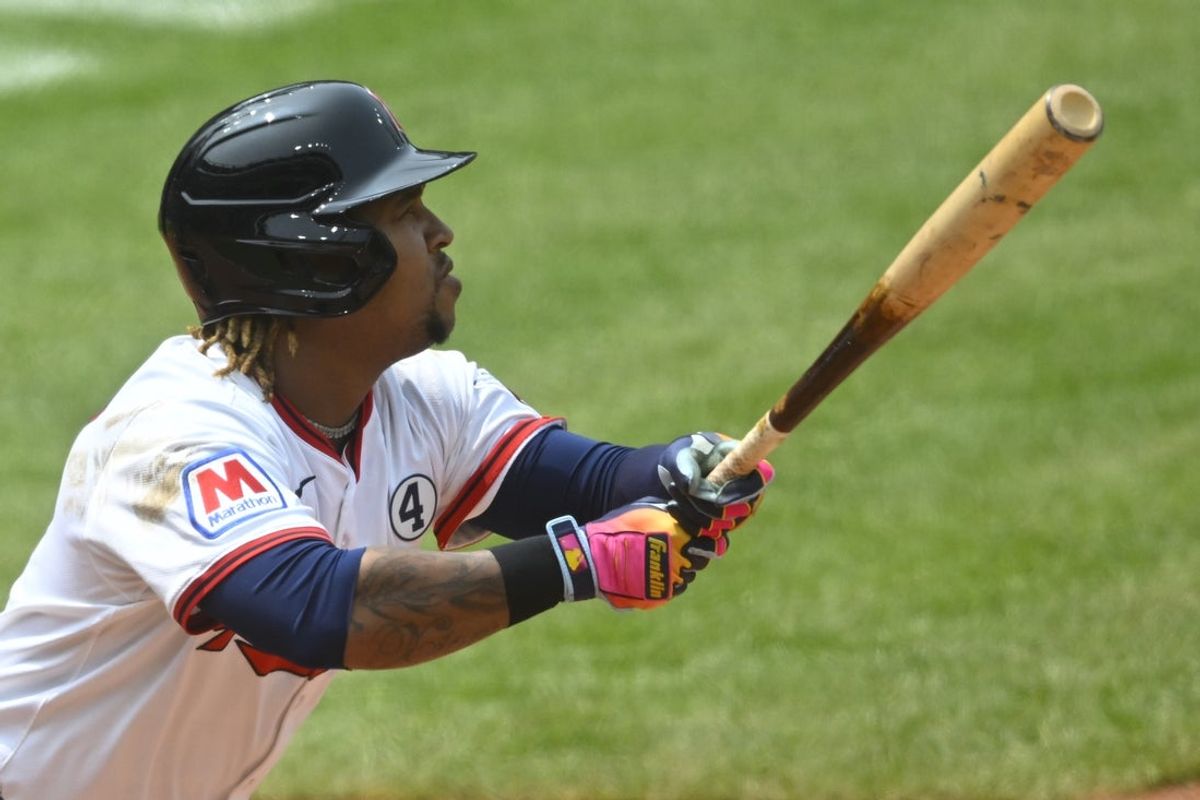 Jun 1, 2025; Cleveland, Ohio, USA; Cleveland Guardians third baseman Jose Ramirez (11) hits a solo home run in the fourth inning against the Los Angeles Angels at Progressive Field. Mandatory Credit: David Richard-Imagn Images