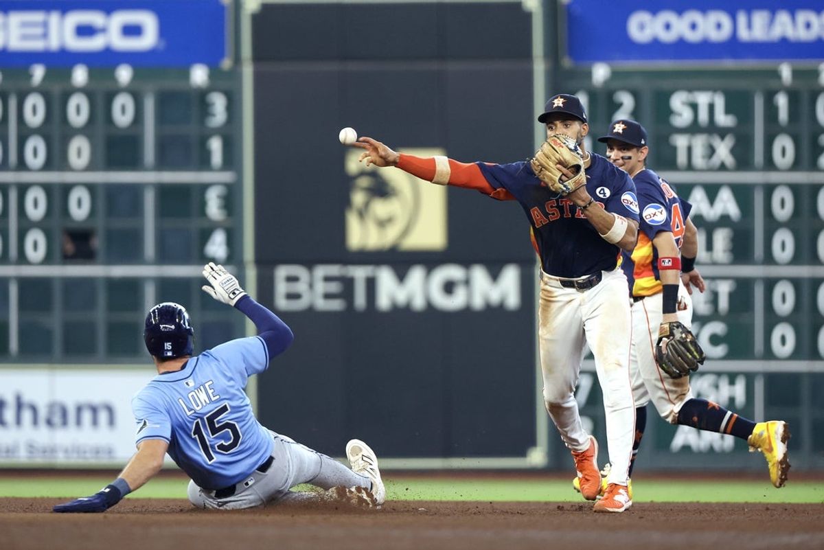 Jun 1, 2025; Houston, Texas, USA; Houston Astros shortstop Jeremy Pena (3) forces out Tampa Bay Rays right fielder Josh Lowe (15) at second base and turns a double play in the sixth inning at Daikin Park. Mandatory Credit: Thomas Shea-Imagn Images