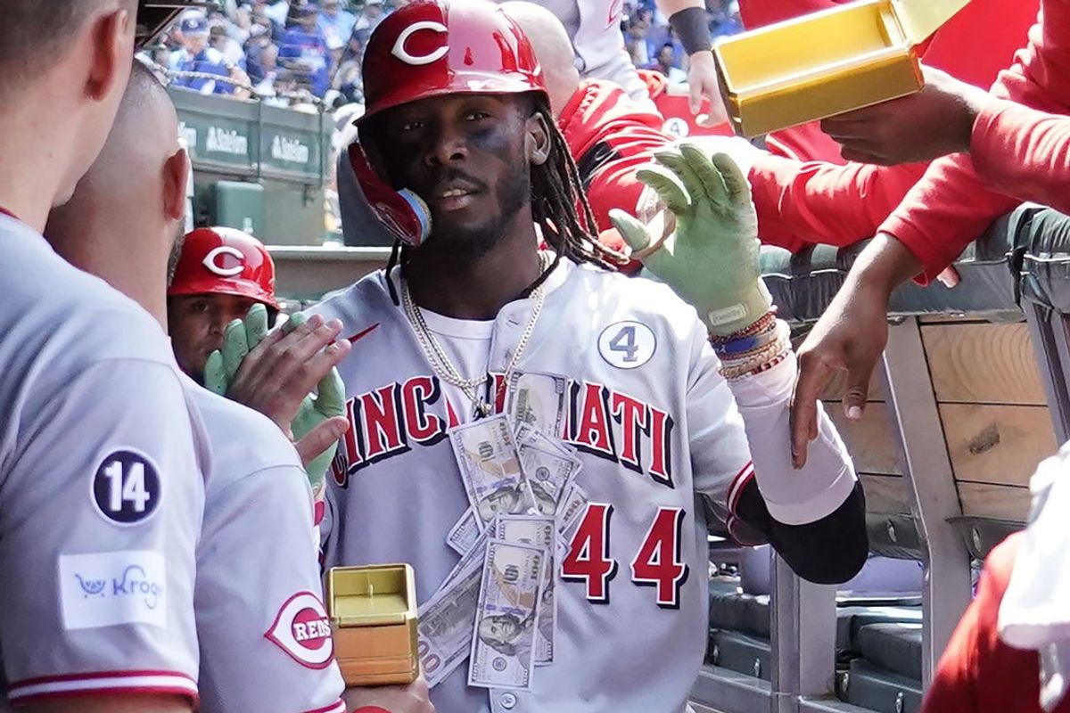 Jun 1, 2025; Chicago, Illinois, USA; Cincinnati Reds shortstop Elly De La Cruz (44) is greeted in the dugout after hitting two-run home run against the Chicago Cubs during the sixth inning at Wrigley Field. Mandatory Credit: David Banks-Imagn Images