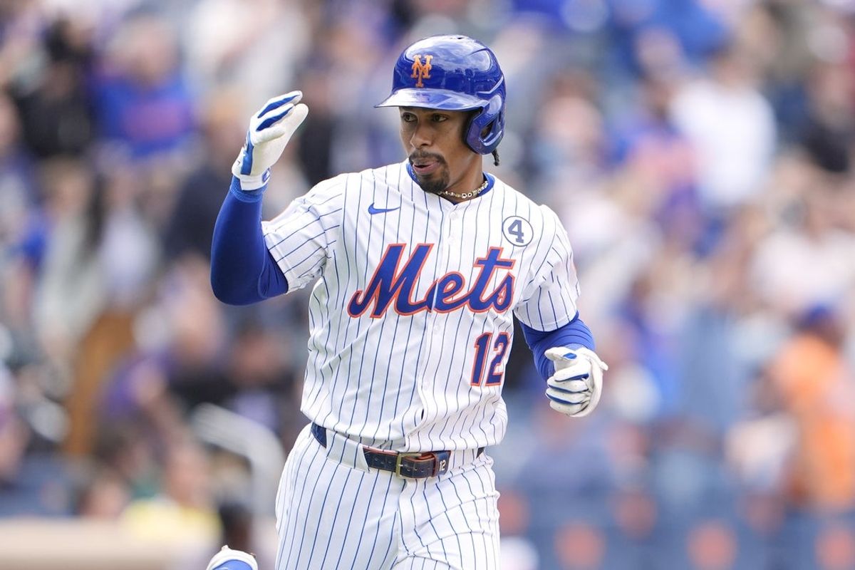 Jun 1, 2025; New York City, New York, USA; New York Mets shortstop Francisco Lindor (12) reacts to hitting a home run against the Colorado Rockies during the fifth inning at Citi Field. Mandatory Credit: Gregory Fisher-Imagn Images