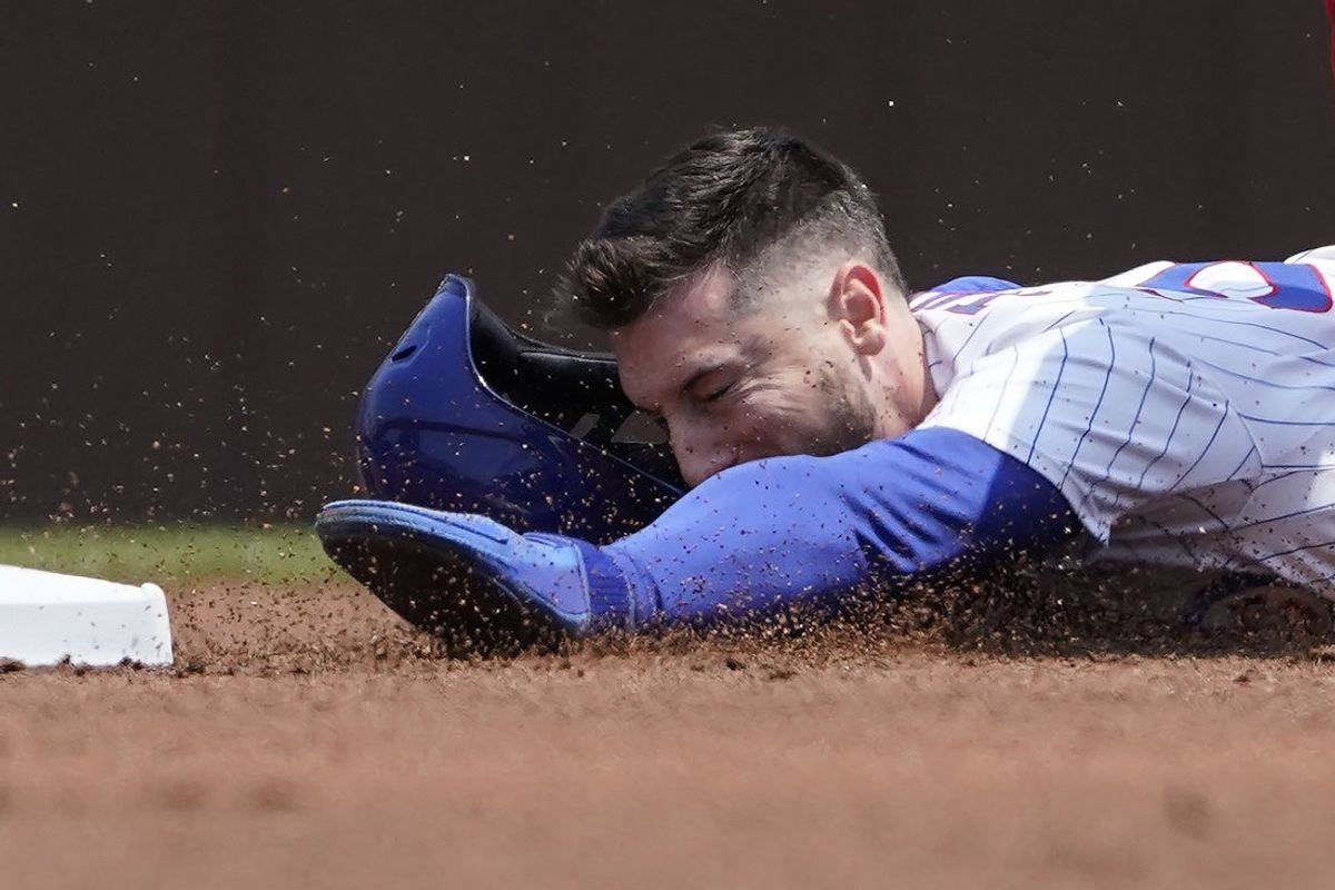 Jun 1, 2025; Chicago, Illinois, USA; Chicago Cubs outfielder Kyle Tucker (30) attempts to steal second base against the Cincinnati Reds during the first inning at Wrigley Field. Mandatory Credit: David Banks-Imagn Images