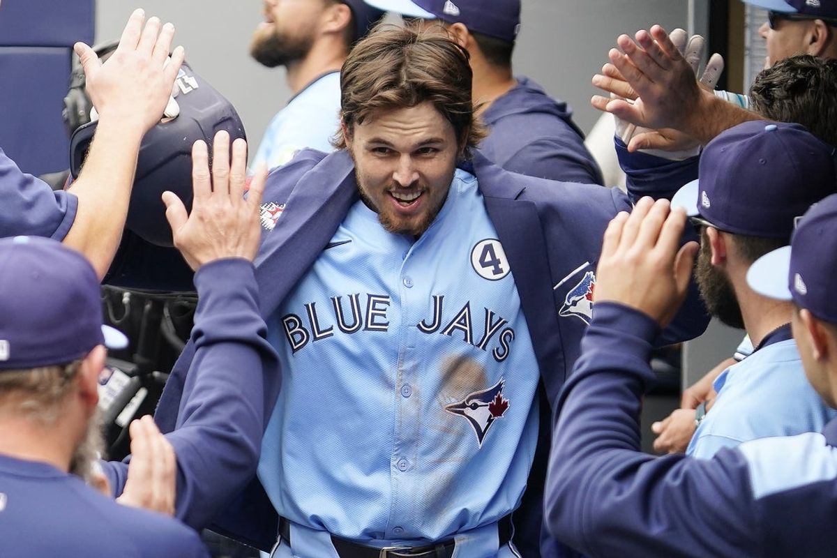 Jun 1, 2025; Toronto, Ontario, CAN; Toronto Blue Jays third baseman Addison Barger (47) celebrates with teammates after hitting a three run home run against the Athletics during the eighth inning at Rogers Centre. Mandatory Credit: John E. Sokolowski-Imagn Images