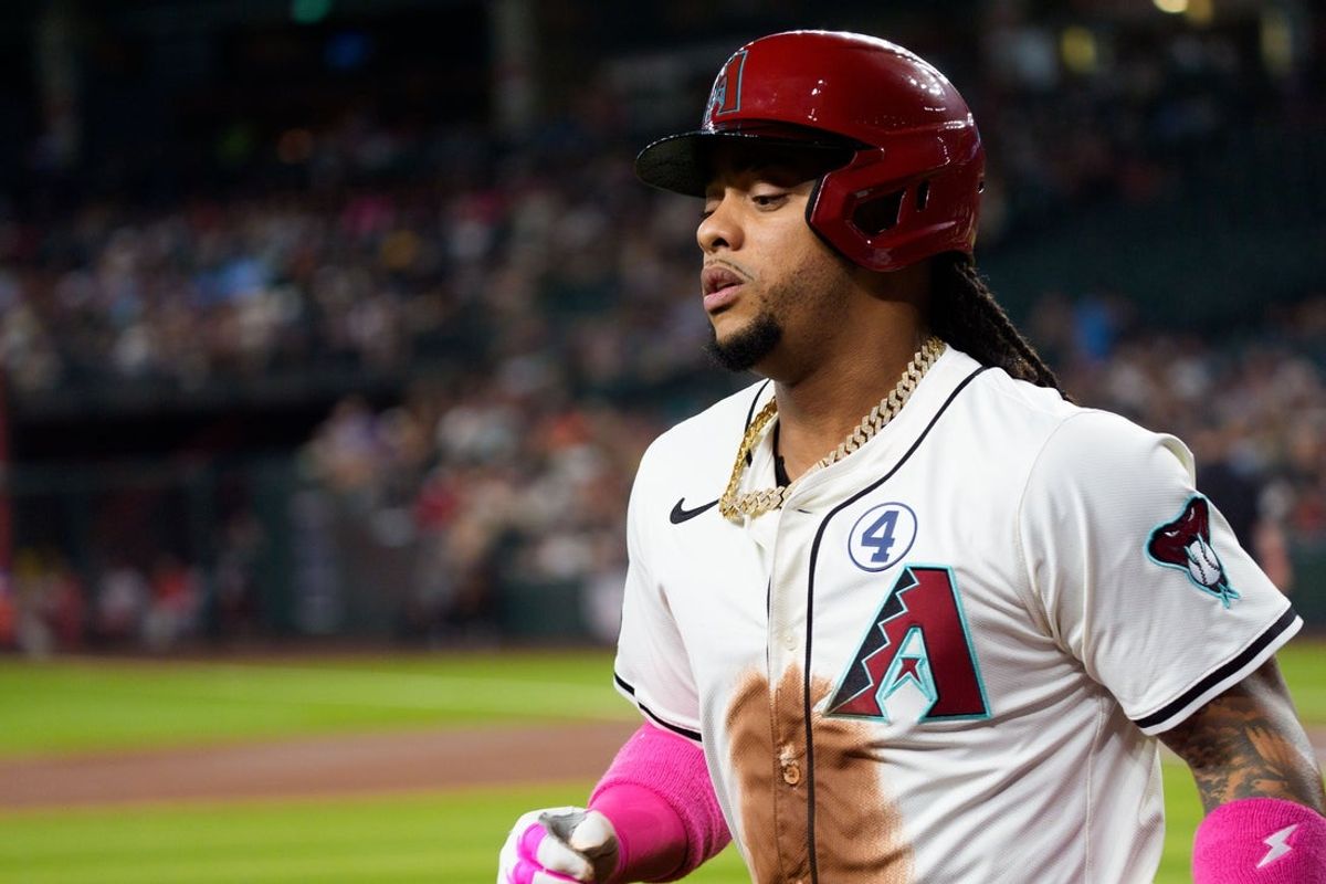 Jun 1, 2025; Phoenix, Arizona, USA; Arizona Diamondbacks infielder Ketel Marte (4) reacts after scoring in the first inning against the Washington Nationals at Chase Field. Mandatory Credit: Allan Henry-Imagn Images