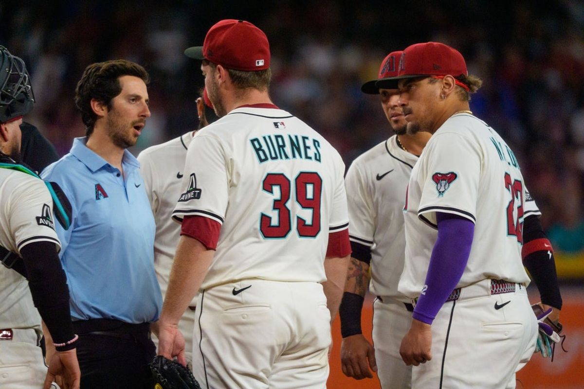 Jun 1, 2025; Phoenix, Arizona, USA; Arizona Diamondbacks starting pitcher Corbin Burnes (39) reacts after an injury in the fith inning and leaves the field against the Washington Nationals at Chase Field. Mandatory Credit: Allan Henry-Imagn Images