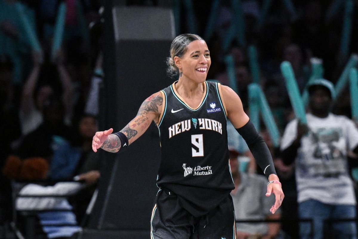 Jun 1, 2025; Brooklyn, New York, USA; New York Liberty guard Natasha Cloud (9) reacts after making a three point basket against the Connecticut Sun during the second half at Barclays Center. Mandatory Credit: John Jones-Imagn Images