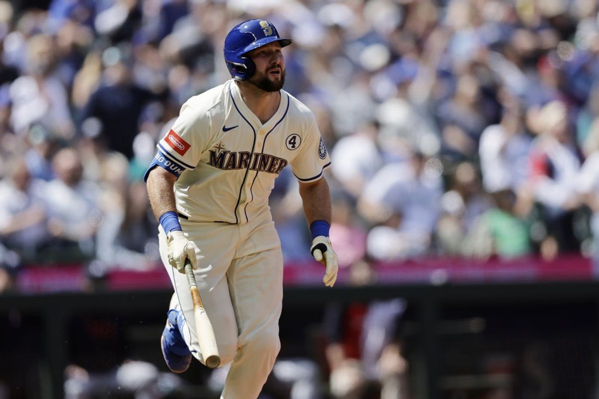 Jun 1, 2025; Seattle, Washington, USA; Seattle Mariners catcher Cal Raleigh (29) hits a solo home run against the Minnesota Twins during the seventh inning at T-Mobile Park. Mandatory Credit: John Froschauer-Imagn Images