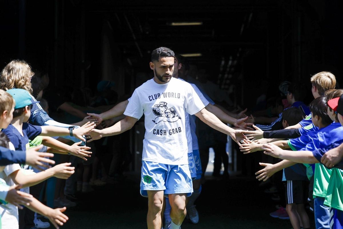 Jun 1, 2025; Seattle, Washington, USA; Seattle Sounders FC midfielder Cristian Roldan (7) wears a t-shirt to protest FIFA Club World Cup bonus sharing from MLS before pregame warmups against the Minnesota United at Lumen Field. Mandatory Credit: Joe Nicholson-Imagn Images