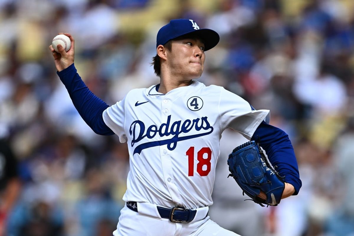 Jun 1, 2025; Los Angeles, California, USA;  Los Angeles Dodgers starting pitcher Yoshinobu Yamamoto (18) throws a pitch against the New York Yankees during the first inning at Dodger Stadium. Mandatory Credit: Jonathan Hui-Imagn Images