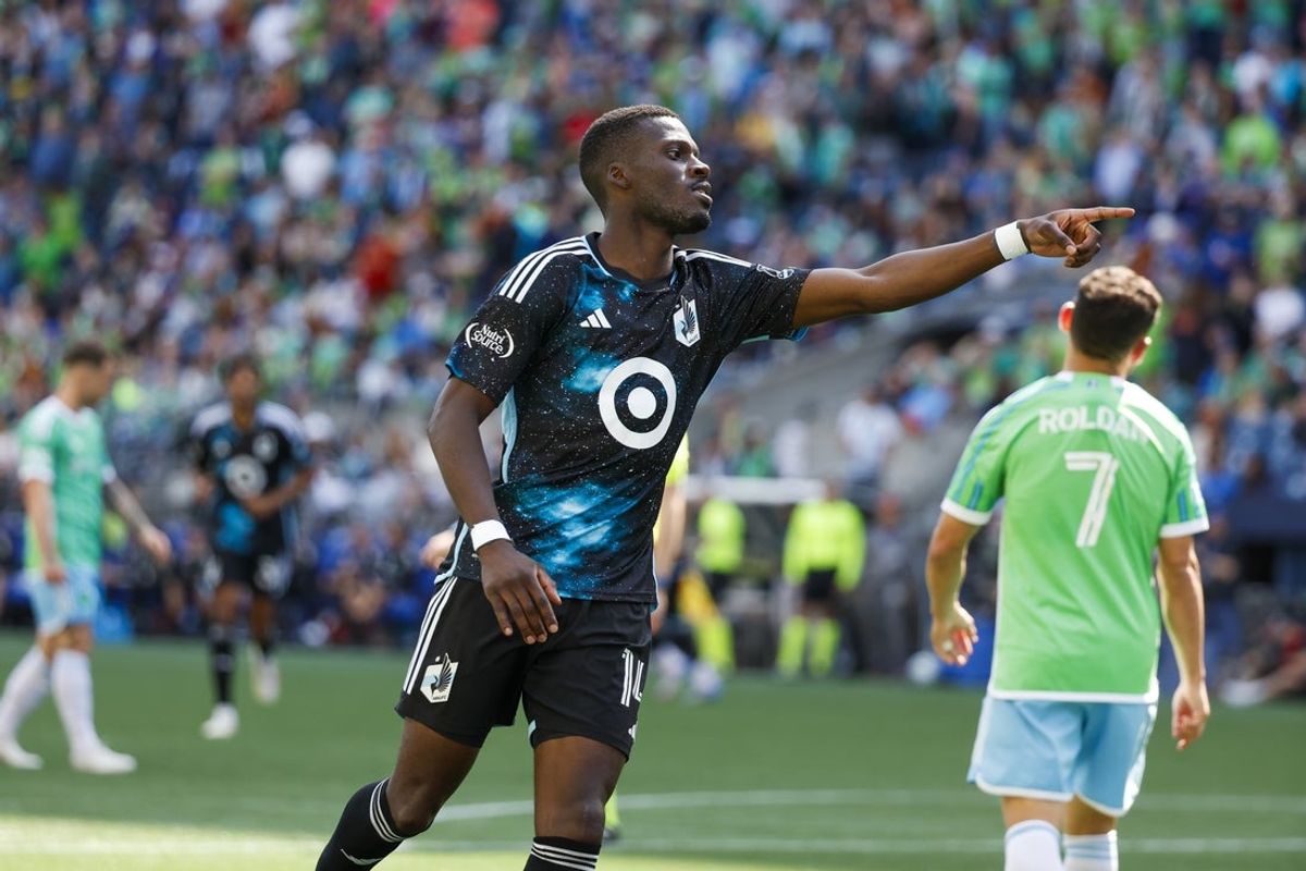 Jun 1, 2025; Seattle, Washington, USA; Minnesota United forward Tani Oluwaseyi (14) celebrates after scoring a goal against the Seattle Sounders FC during the second half at Lumen Field. Mandatory Credit: Joe Nicholson-Imagn Images