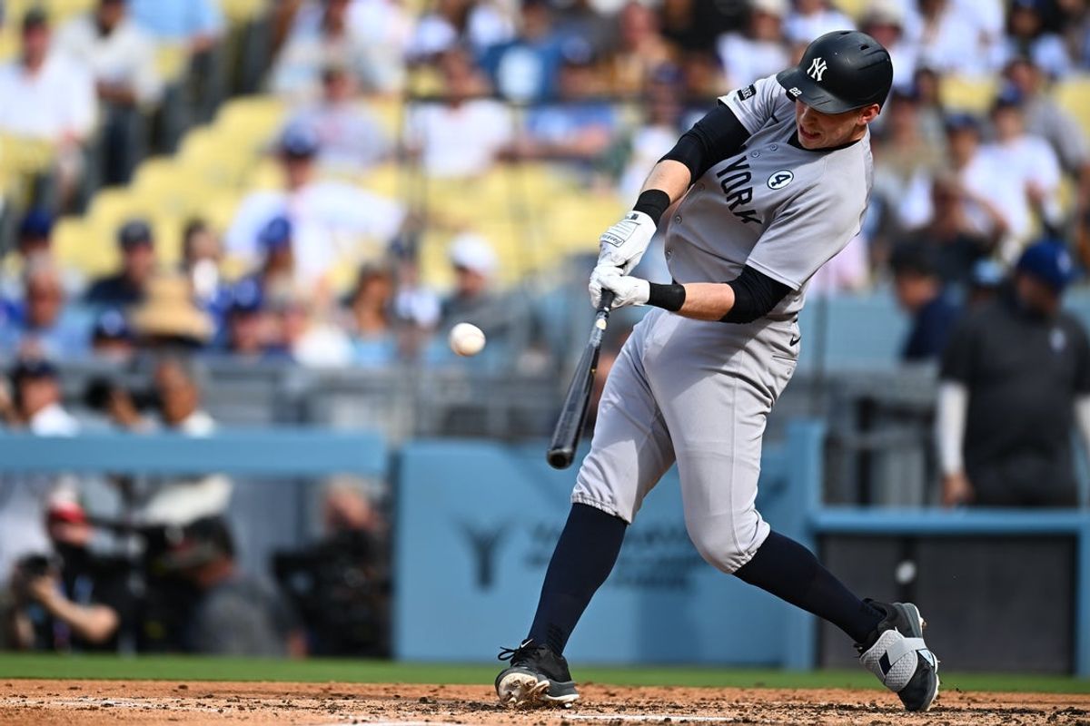 Jun 1, 2025; Los Angeles, California, USA;  New York Yankees designated hitter Ben Rice (22) hits a two-run home run against the Los Angeles Dodgers during the third inning at Dodger Stadium. Mandatory Credit: Jonathan Hui-Imagn Images