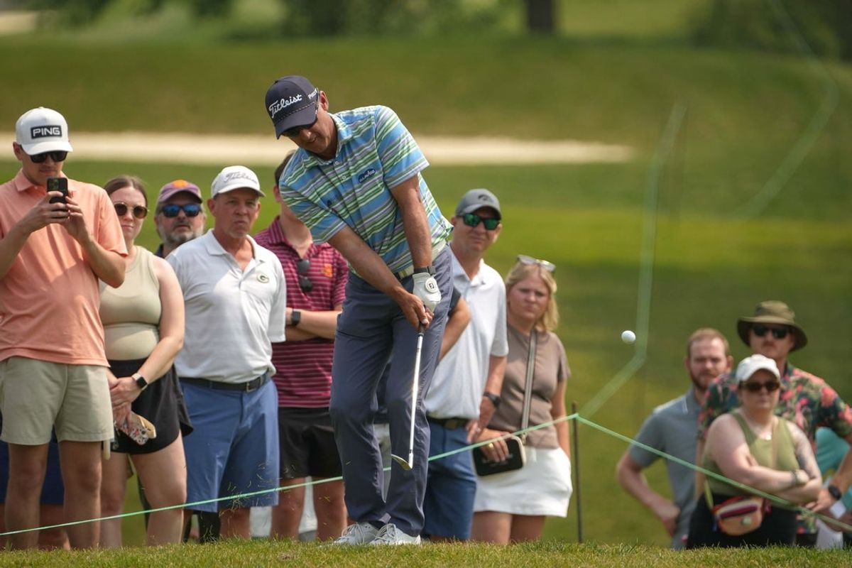 With the crowd watching along the rope line, Cameron Percy chips his ball onto the green during the 2025 Principal Charity Classic on Sunday, June 1, 2025, at the Wakonda Club in Des Moines.