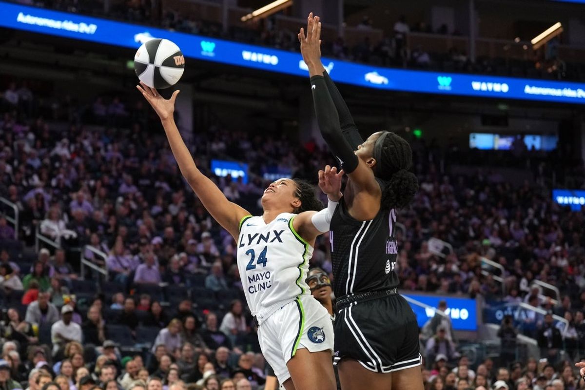 Jun 1, 2025; San Francisco, California, USA; Minnesota Lynx forward Napheesa Collier (24) shoots against Golden State Valkyries center Temi Fagbenle (right) during the second quarter at Chase Center. Mandatory Credit: Darren Yamashita-Imagn Images