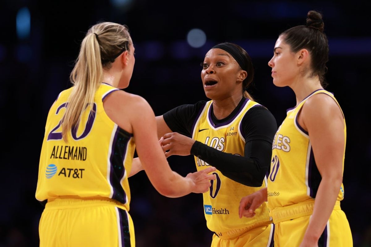 Jun 1, 2025; Los Angeles, California, USA;  Los Angeles Sparks guard Odyssey Sims (0, center) speaks to guard Julie Allemand (20) and guard Kelsey Plum (10) during the first half against the Phoenix Mercury at Crypto.com Arena. Mandatory Credit: Kiyoshi Mio-Imagn Images