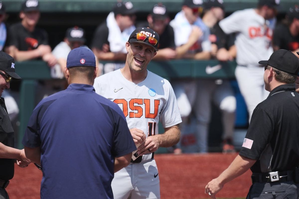 Jun 1, 2025; Corvallis, OR, USA; Oregon St. head coach Mitch Canham talks to referees before a game against Saint Mary's at the NCAA Corvallis Regional at Goss Stadium. Mandatory Credit: Troy Wayrynen-Imagn Images