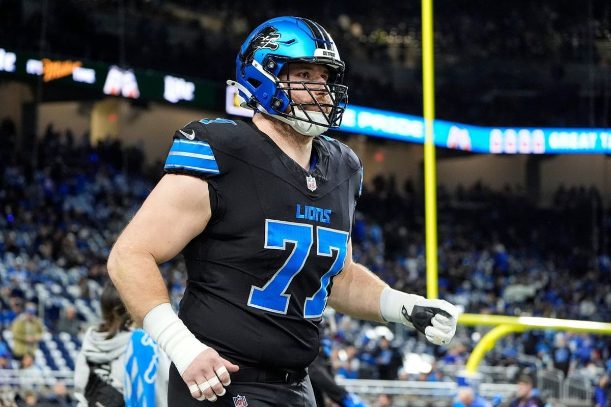 Detroit Lions center Frank Ragnow (77) warms up before the game between Detroit Lions and Buffalo Bills at Ford Field in Detroit on Sunday, Dec. 15, 2024.
