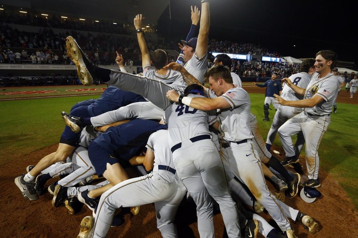 Jun 2, 2025; Oxford, MS, USA; The Murray State Racers dog pile on the mound after defeating the Mississippi Rebels in the Oxford Regional. Mandatory Credit: Petre Thomas-Imagn Images