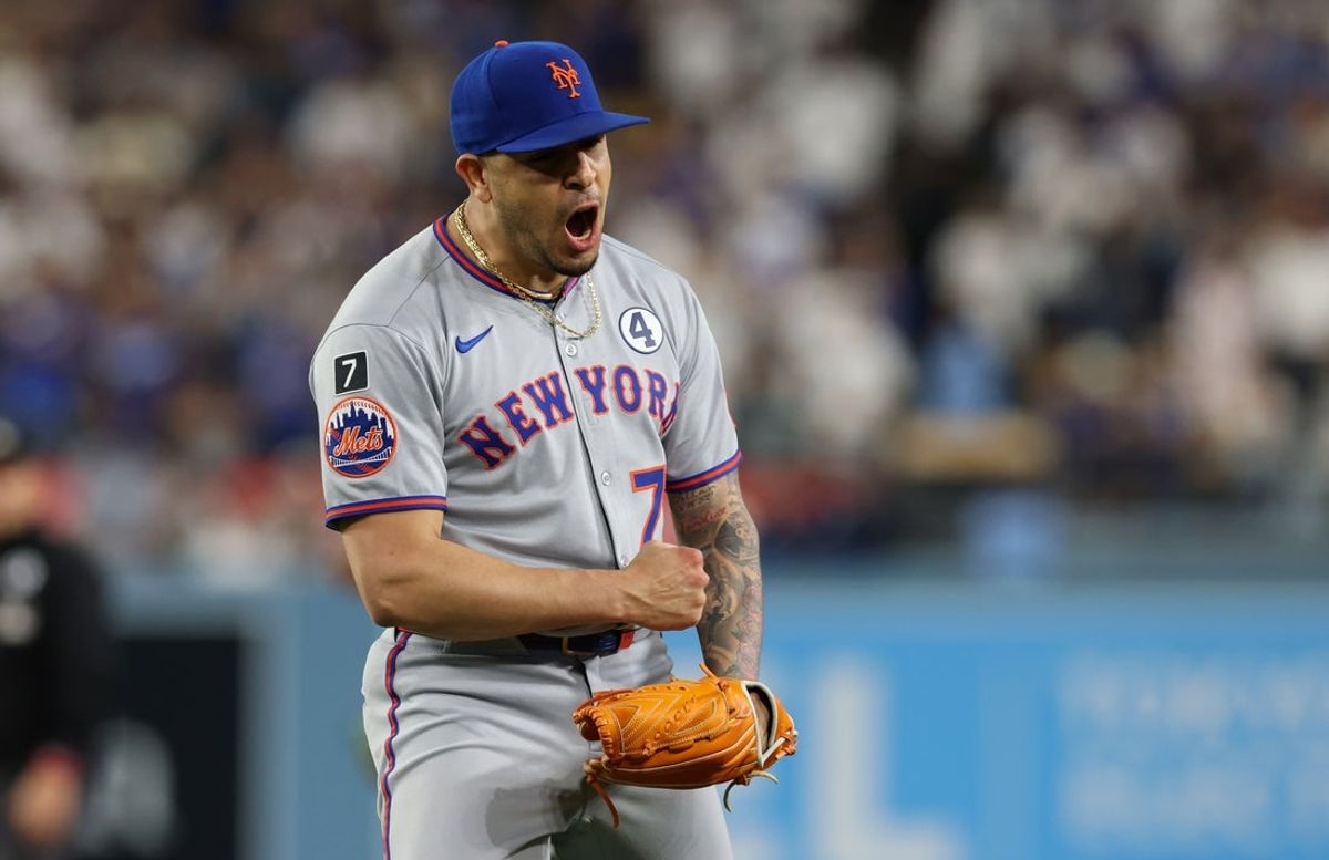 Jun 2, 2025; Los Angeles, California, USA; New York Mets pitcher Jose Butto (70) reacts after defeating the Los Angeles Dodgers at Dodger Stadium. Mandatory Credit: Jason Parkhurst-Imagn Images
