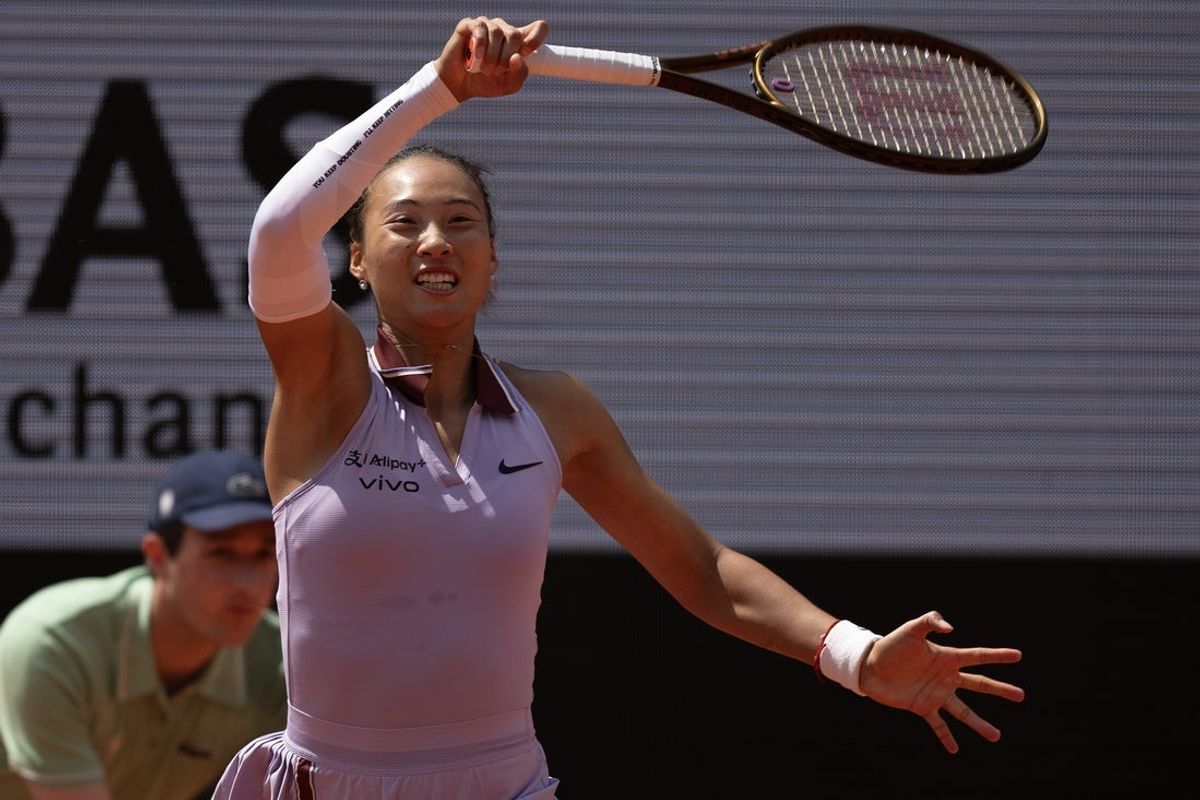 Jun 3, 2025; Paris, FR; Qinwen Zheng  of China returns a shot during her match against Aryna Sabalenka on day 10 at Roland Garros Stadium.  Mandatory Credit: Susan Mullane-Imagn Images