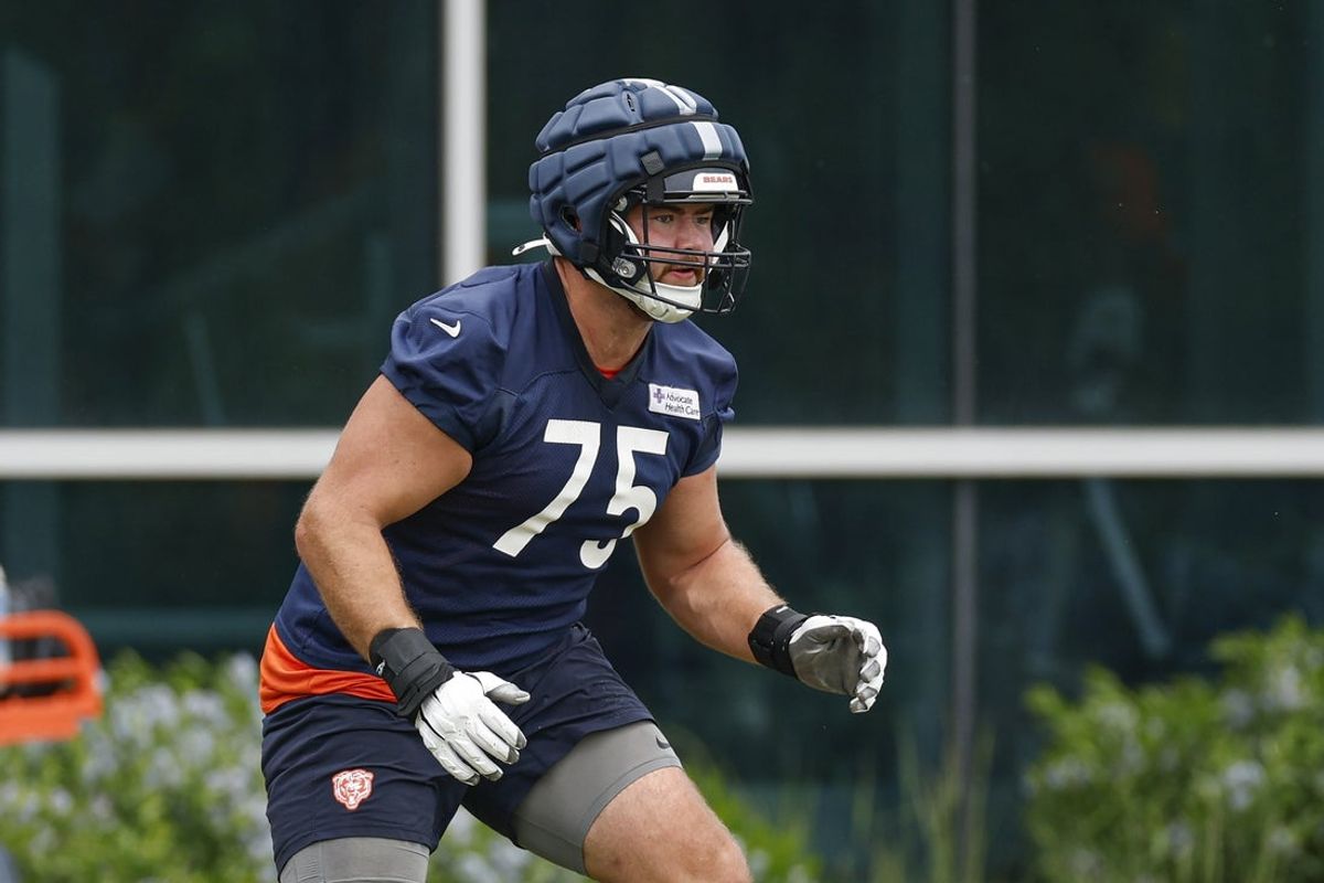 Jun 3, 2025; Lake Forest, IL, USA; Chicago Bears offensive tackle Ozzy Trapilo (75) warms up during minicamp at Halas Hall. Mandatory Credit: Kamil Krzaczynski-Imagn Images