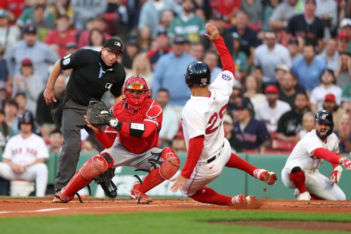 Jun 3, 2025; Boston, Massachusetts, USA; Los Angeles Angels catcher Travis d'Arnaud (25) tags out Boston Red Sox third baseman Abraham Toro (29) during the second inning at Fenway Park. Mandatory Credit: Paul Rutherford-Imagn Images
